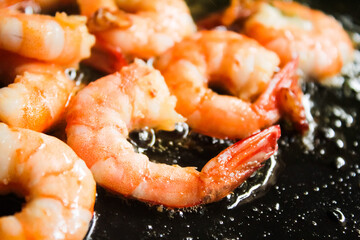 Prawns being cooked in hot oil
