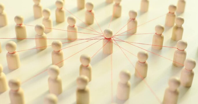 Wooden pins connected to central pawn with thin red threads