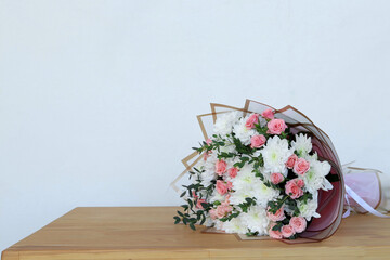 Beautiful flowers on table indoors. Space for text