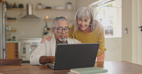 Obraz premium Senior couple, home and laptop for internet research with for retirement and social media update. Interracial marriage, old man and woman with computer in kitchen for video call app and virtual chat