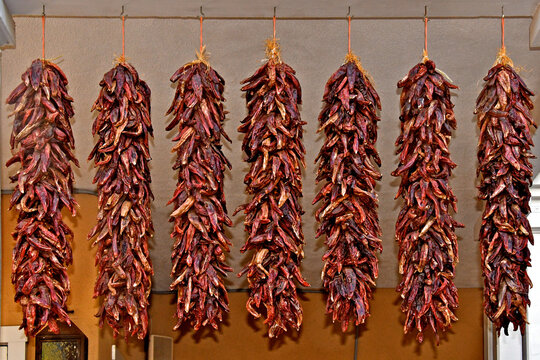 Dried chilies on ristras ready to add flavor  and heat to New Mexican cuisine 