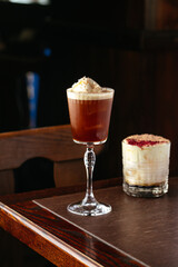 alcoholic cocktail with ice cream in the interior of the bar