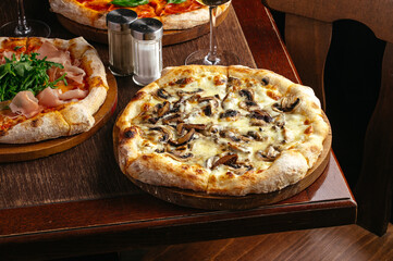 Italian pizza with cheese and mushrooms restaurant menu