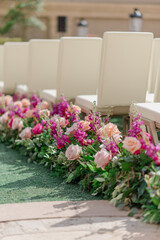 Rose and greenery aisle floral design for wedding