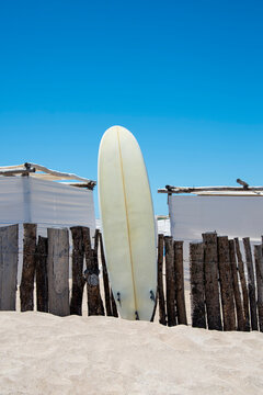 Surf board in the sand of a beach