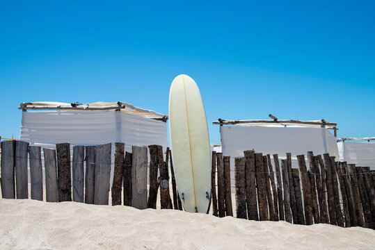 Surf board in the sand of a beach