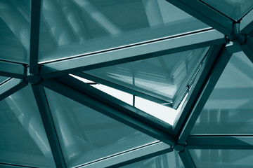 glass transparent roof. sky and sunset sunlight during evening. Roof design, construction, modern ideas. triangle window frame. opened window frame.