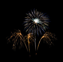 Festive new year colorful fireworks on black background