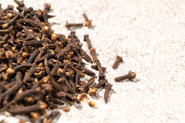 Dried clove spice on a gray stone background, macro