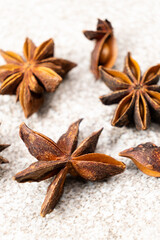 Spice star anise closeup on gray stone background