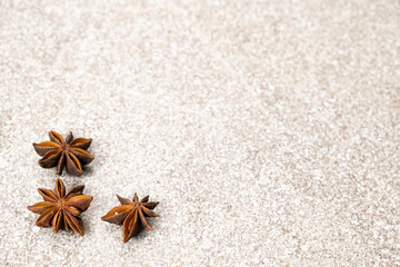 Spice star anise closeup on gray stone background, copy space for text