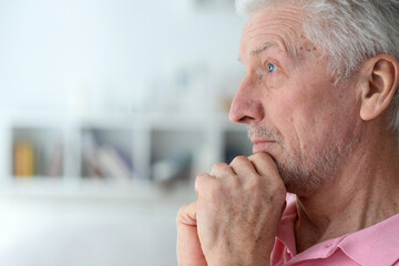 Fototapeta premium close-up portrait of a senior man thinking about something