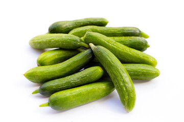 Mini cucumbers on white background.
