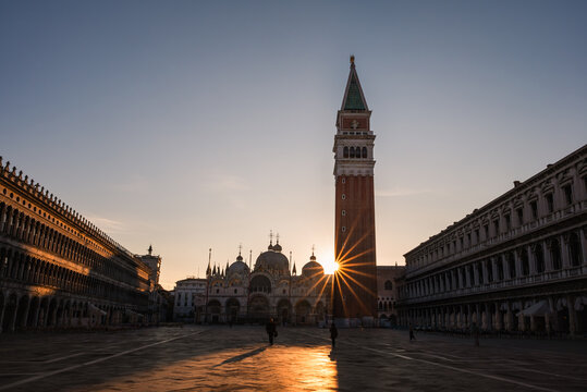 View of buildings in Piazza San Marco in Venice, Italy at sunrise.