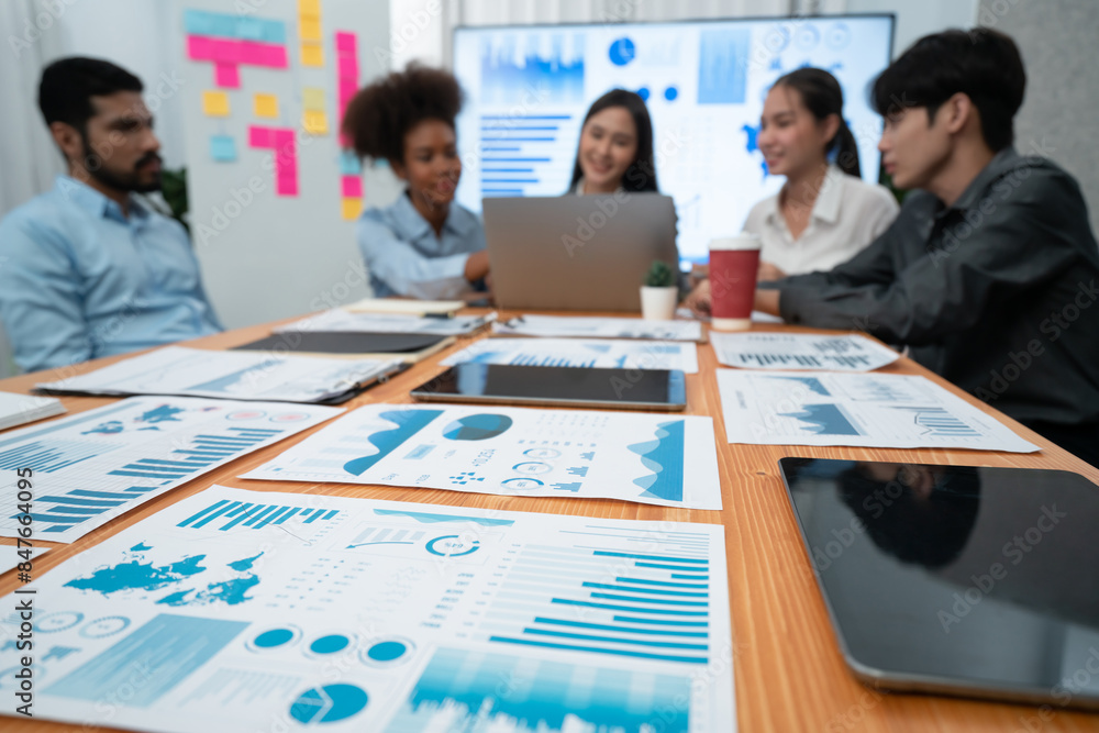Poster focus financial dashboard paper showing graphs and chart with blurred background of diverse business