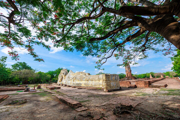 Reclining Buddha at Wat Lokayasutharam, historical site of Ayutthaya, Thailand On a clear blue day