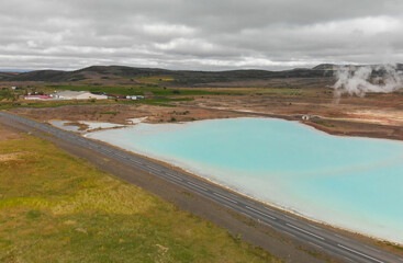 Aerial view of Blue lake made from water coming out of geothermal power plant from above, Iceland