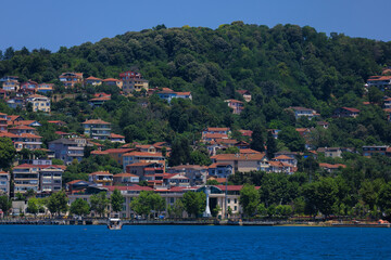 Blue seascape overlooking the coast. View of the Bosphorus in Istanbul city on sunny summer day, in a public place.