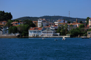 Fototapeta premium Blue seascape overlooking the coast. View of the Bosphorus in Istanbul city on sunny summer day, in a public place.
