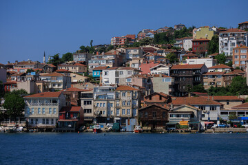 Fototapeta premium Blue seascape overlooking the coast. View of the Bosphorus in Istanbul city on sunny summer day, in a public place.