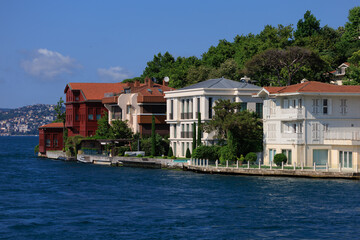 Obraz premium Blue seascape overlooking the coast. View of the Bosphorus in Istanbul city on sunny summer day, in a public place.