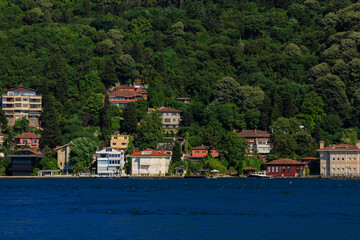 Blue seascape overlooking the coast. View of the Bosphorus in Istanbul city on sunny summer day, in a public place.