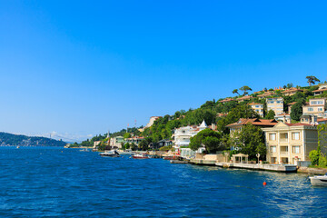 Fototapeta premium Blue seascape overlooking the coast. View of the Bosphorus in Istanbul city on sunny summer day, in a public place.