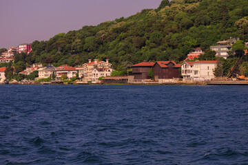 Fototapeta premium Blue seascape overlooking the coast. View of the Bosphorus in Istanbul city on sunny summer day, in a public place.