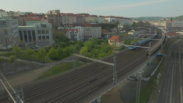 Drone of Trains coming and going from Prague Main Railway Station - Praha Hlavn&iacute; N&aacute;draž&iacute; - Czech Republic - Aerial Pullback Shot , Ceske Drahy CD - Czechia