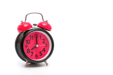 Retro alarm clock isolated on white background close up. Time concept