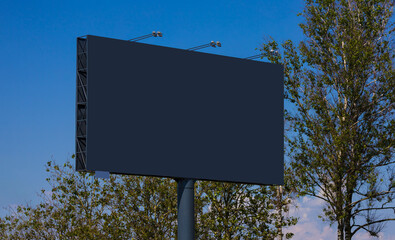 Background for design. Advertising billboard along the road in the city 