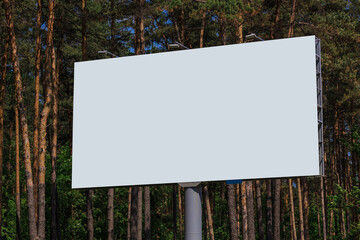 White billboard along the highway. Background for design and advertising. 