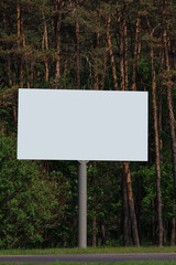 White billboard along the highway. Background for design and advertising. 