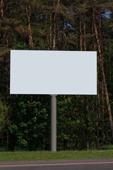 White billboard along the highway. Background for design and advertising. 