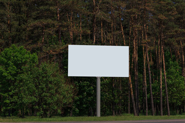 White billboard along the highway. Background for design and advertising. 