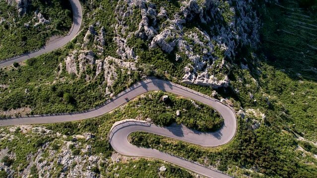 4K Aerial Drone video of mesmerizing serpentine roads in the mountains of Coll dels Reis, Nus de Sa Corbata, Mallorca