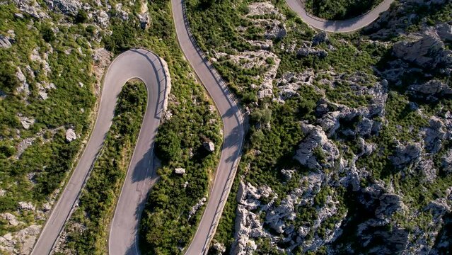 4K Aerial Drone video of mesmerizing serpentine roads in the mountains of Coll dels Reis, Nus de Sa Corbata, Mallorca