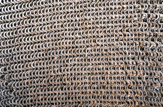 Close-up of a chain mail shirt. Metal fabric. Part of a suit of armor.
