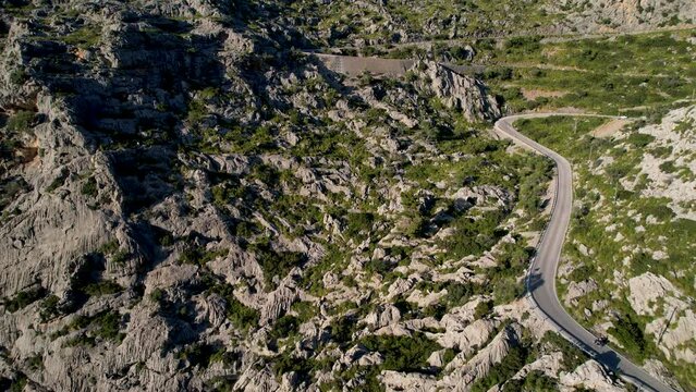 4K Aerial Drone video of mesmerizing serpentine roads in the mountains of Coll dels Reis, Nus de Sa Corbata, Mallorca