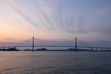 View of the suspension bridge and island after sunset