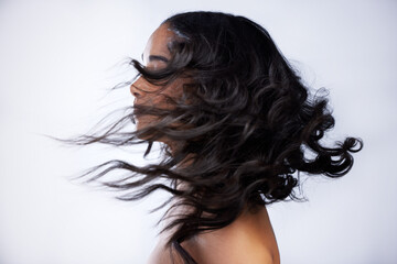 Woman, shaking and hair beauty in studio with luxury keratin treatment, volume and texture shine for growth health. Female person, hairdresser and collagen benefits, cosmetics and white background