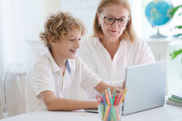 Child in school. Student in class. Boy at homework