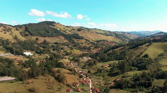 Delfim moreira, ros&aacute;rio neighborhood in minas gerais on a sunny day, aerial view.