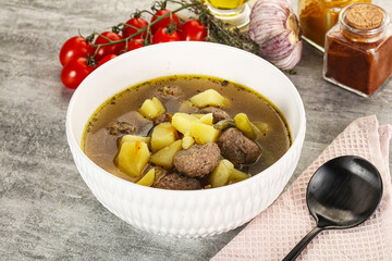 Soup with meatball and potato