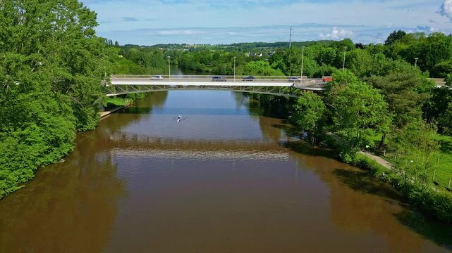 Pont de Pritz bridge over Mayenne River, border between Laval and Chang&eacute;, France. Aerial drone forward