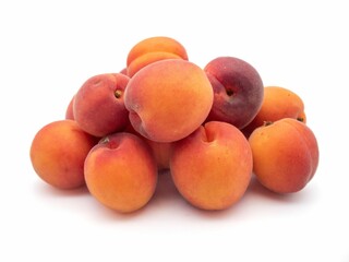 Pile of fresh apricots isolated on a white background.