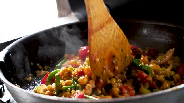 cooking vegetarian food, mix of vegetables in wok