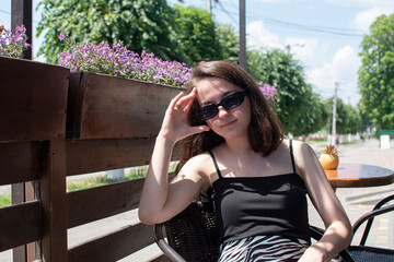 Young attractive woman in sunglasses