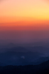dramatic sunset sky with clouds over mountains landscape 
