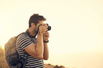 Outdoor, photographer and man with camera, adventure and sunshine view, creative and picture. Person, nature and guy with journey, memory and getaway trip with research, summer and equipment